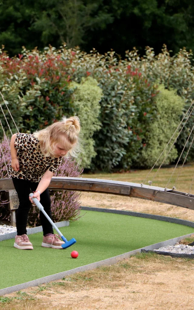 A little girl's mini-golf day at Green Mini Golf