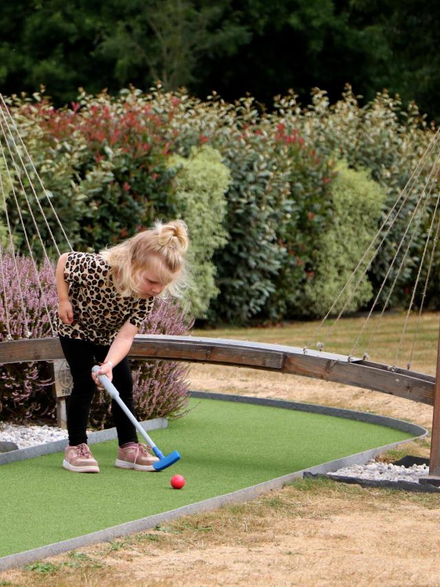 A little girl's mini-golf day at Green Mini Golf